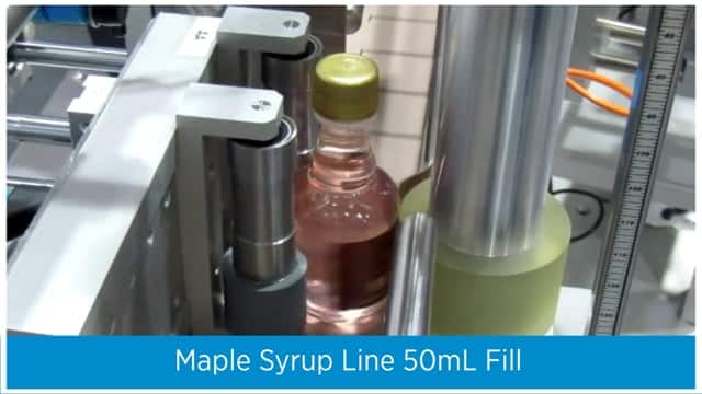 Maple Syrup Line Feeding Turn Table AF1 Automation Kit Eco Prism Labeler Accumulating Turn Table Aesus Packaging Systems