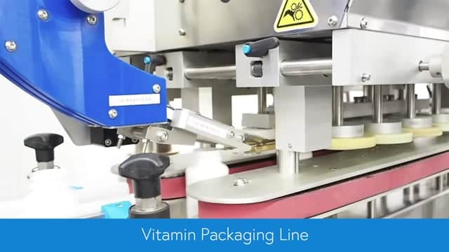 Vitamin Packaging Line Delta Inline Spindle Capper Delta Wrap Labeler Compact Premier Shrink Labeler IR Tunnel Aesus Packaging Systems