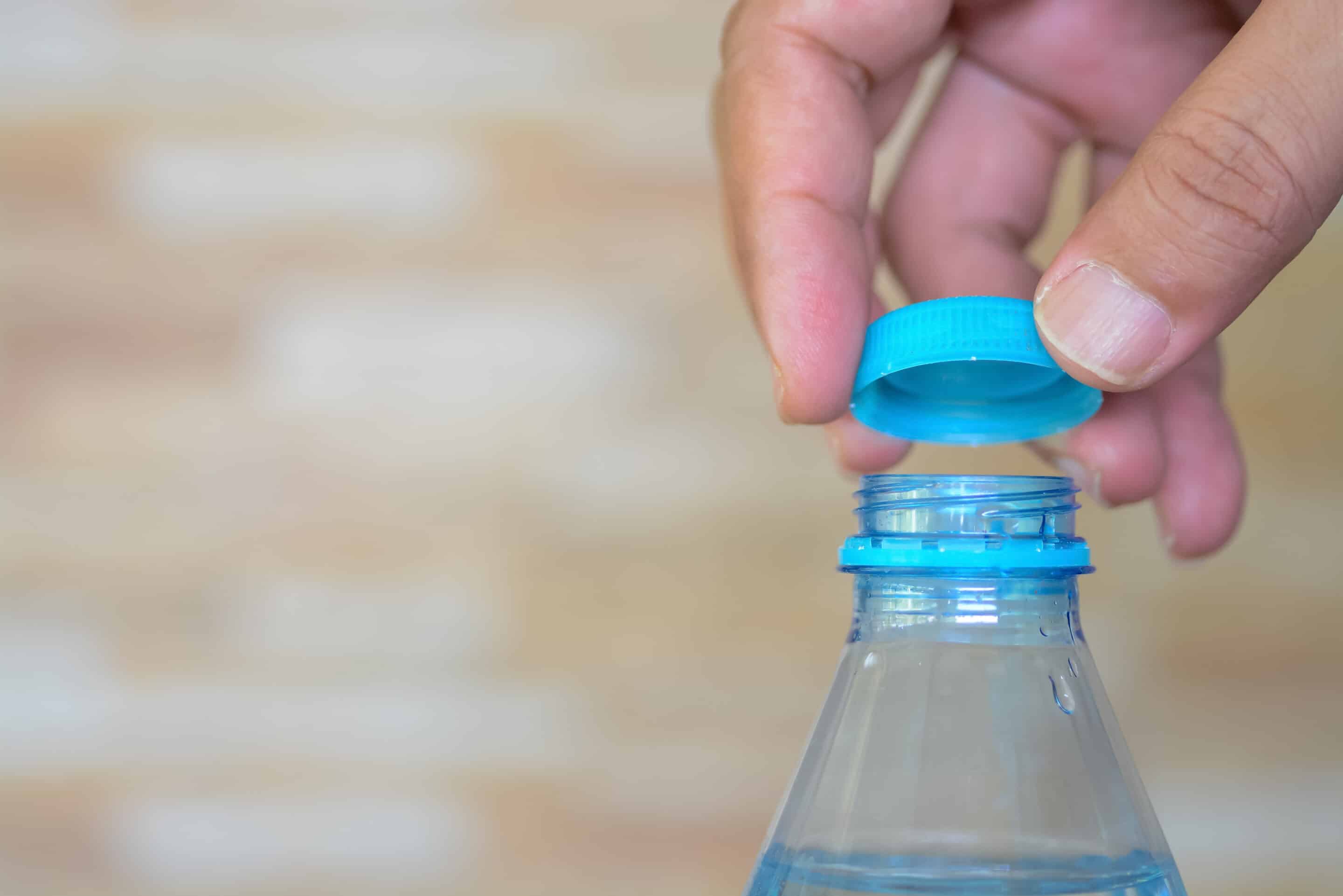 Hands Opening Bottle Cap