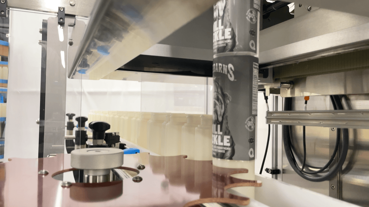 Home • Packaging Machinery • Aesus 19 Application de la gaine thermorétractable Aesus