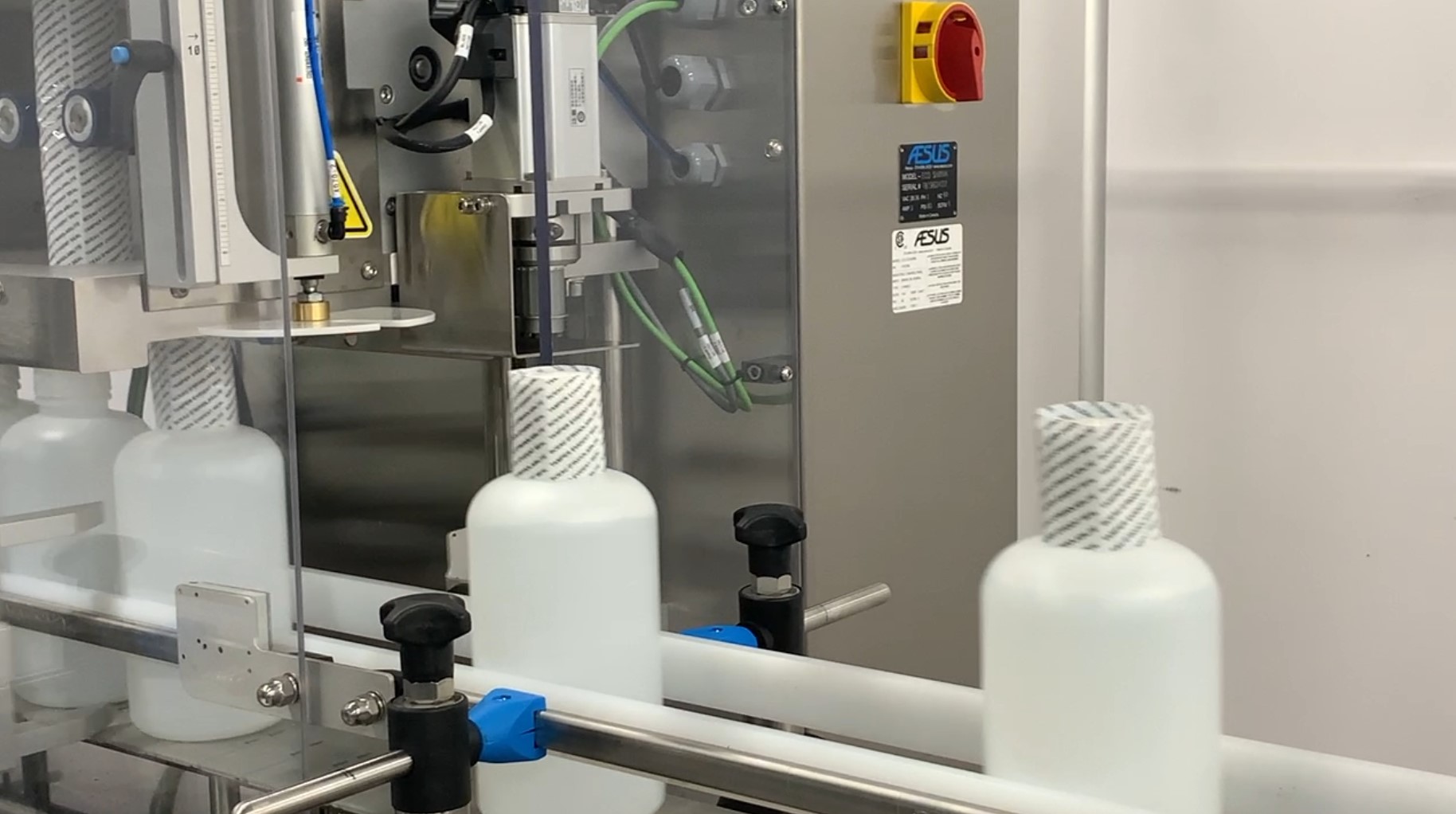 Shrink Labelers & Tunnels • Neck Banding • Full Body Sleeving • Heat Tunnels • Aesus 1 manual vs automatic labelers